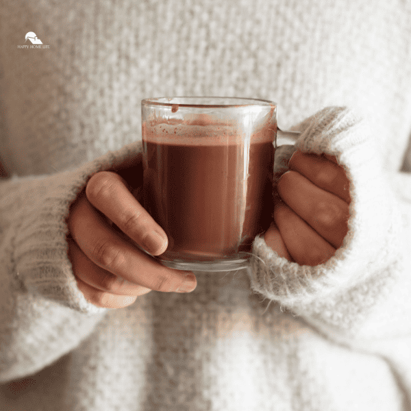 image of someone holding a cup of chocolate drink