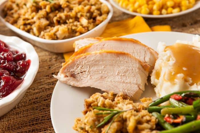 turkey breast and thanksgiving sides on a plate