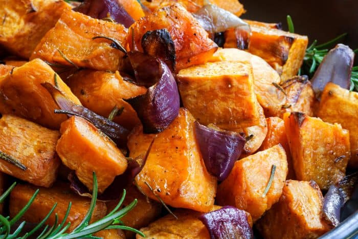 up close roasted sweet potatoes with onions and rosemary