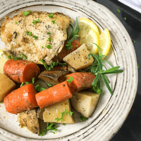 Rosemary Lemon Chicken Thighs in a white plate