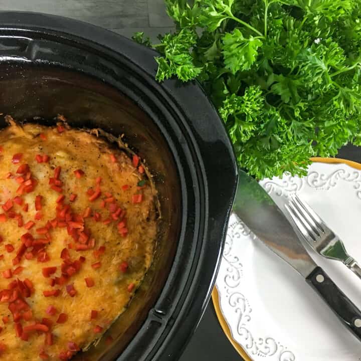 Southwestern breakfast casserole with lettuce and cutlery on the table