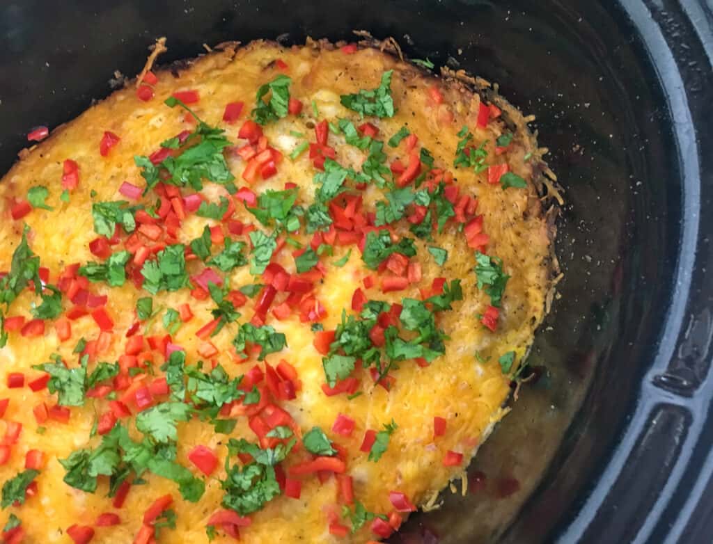 Close up image of Southwestern breakfast casserole in the slow cooker. 