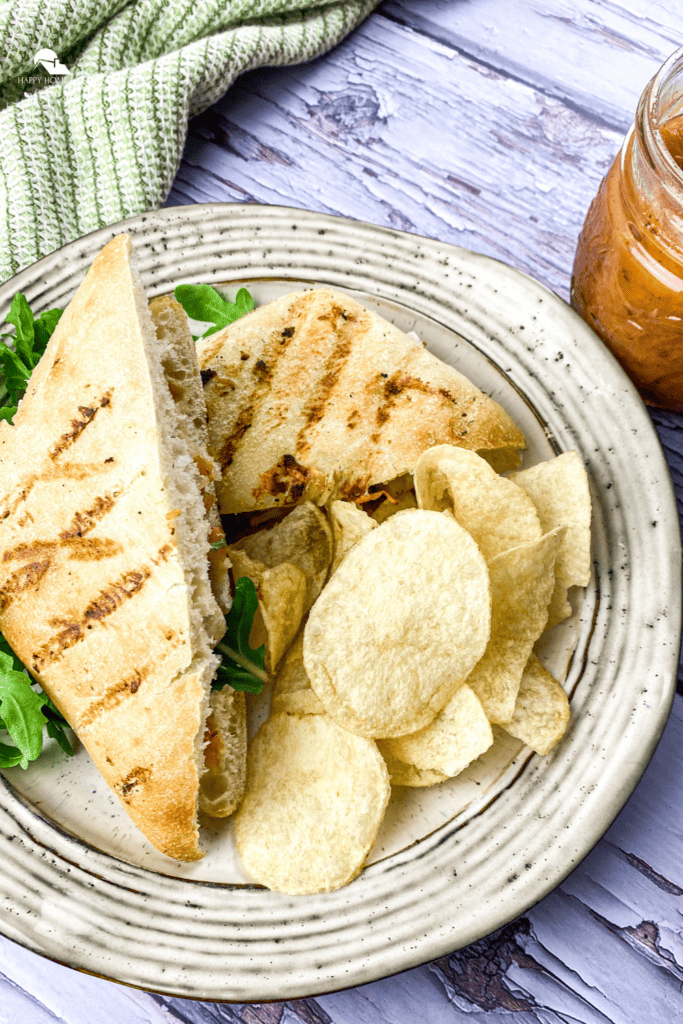 Grilled Chicken & Brie Panini in a white plate