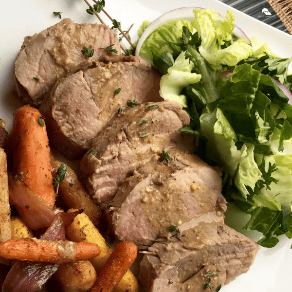 close up image of Mustard Pork Loin with Thyme-Roasted Carrots