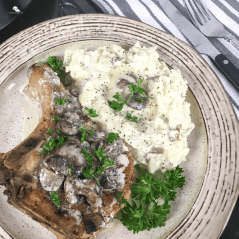 Slow Cooker Thick-Cut Bone-In Pork Chops in a plate