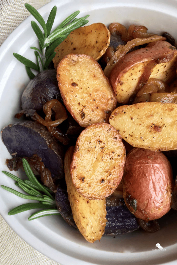 Tri-Color Roasted Rosemary Potatoes in a white bowl on a pin sized image