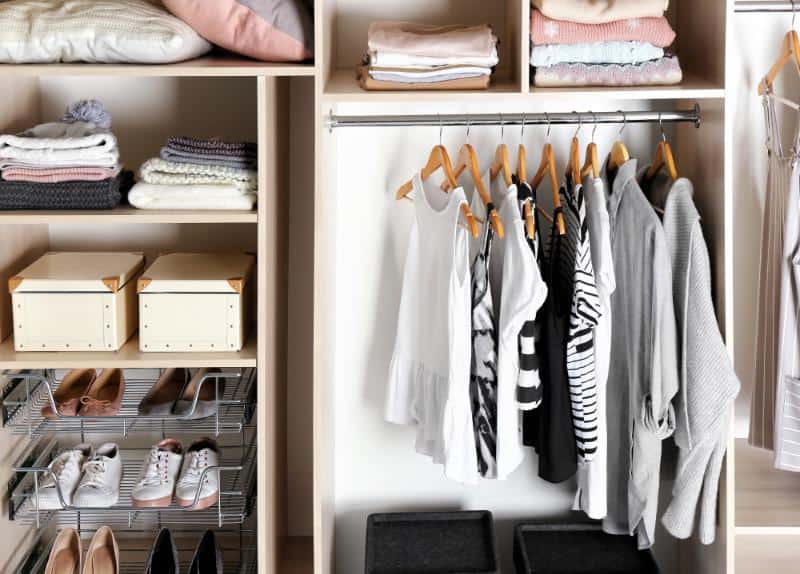 tidy closet with clothes and shoes