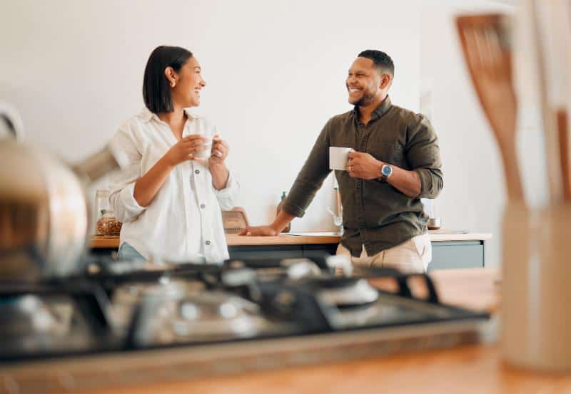 couple enjoying coffee in the kitchen together