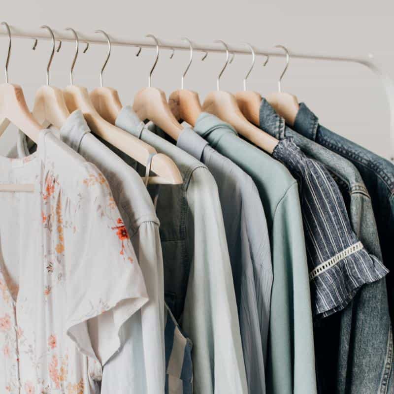 feminine neutral clothes on hangers