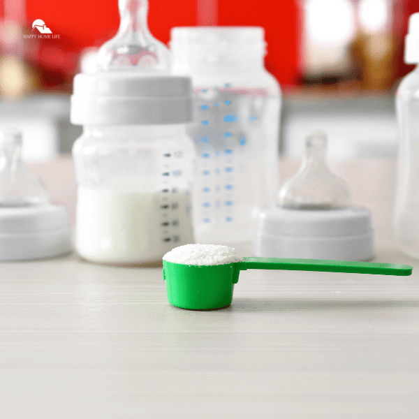 Feeding Bottles and Baby Milk Formula on Table