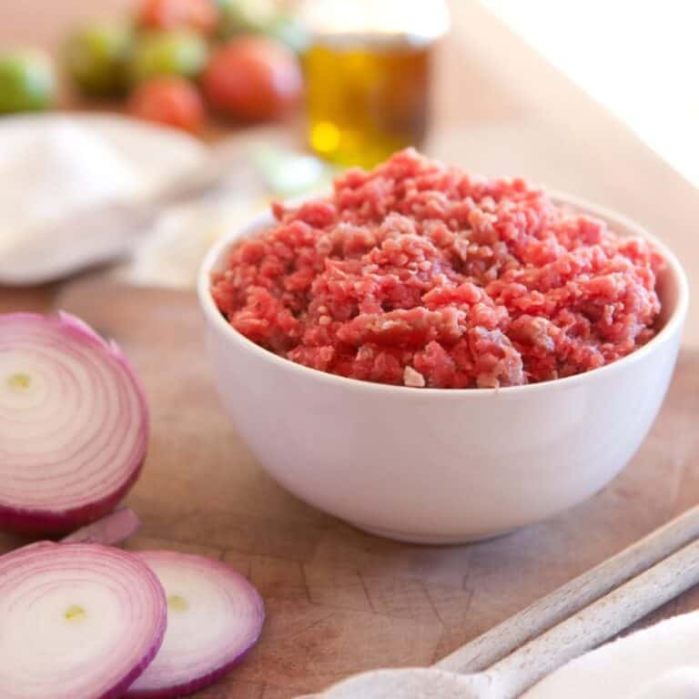 raw ground beef in small white bowl