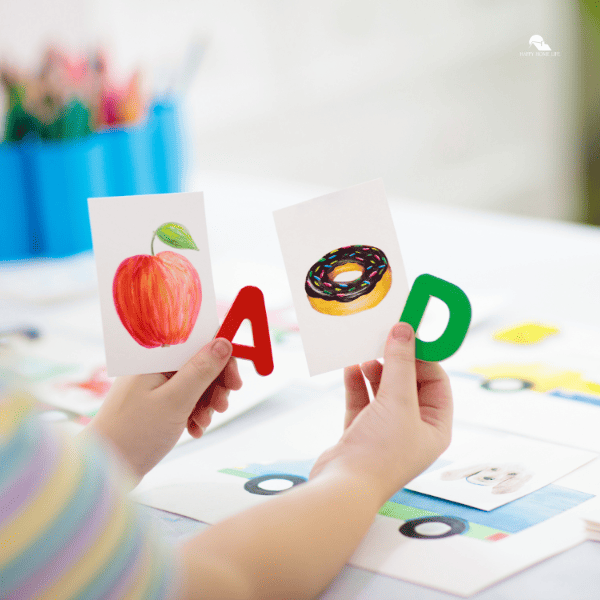 kid playing with flashcards