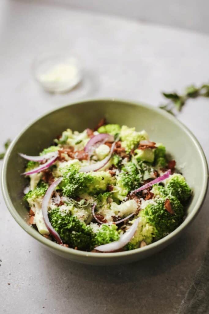 broccoli salad in light green dish