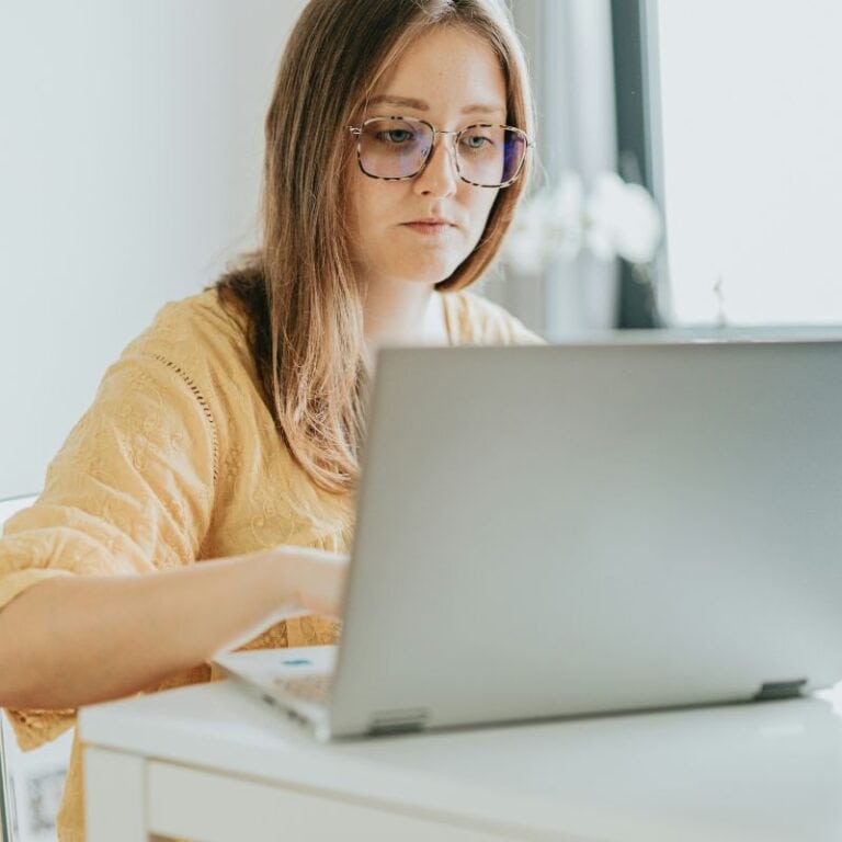 woman using a laptop at a table