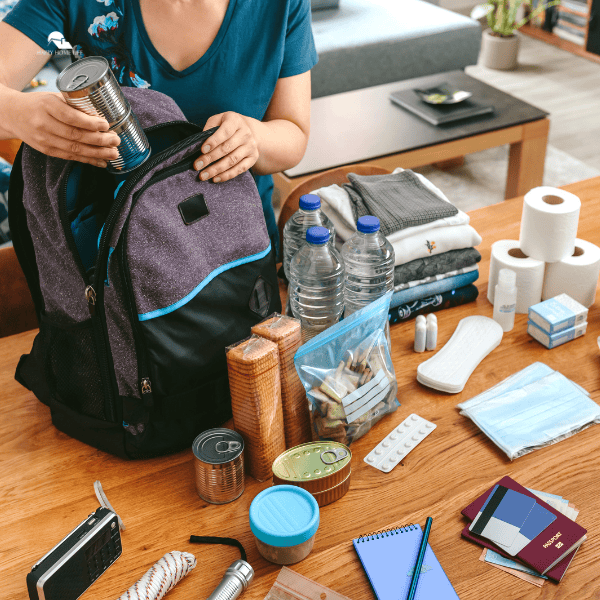 Woman Preparing an Emergency Kit