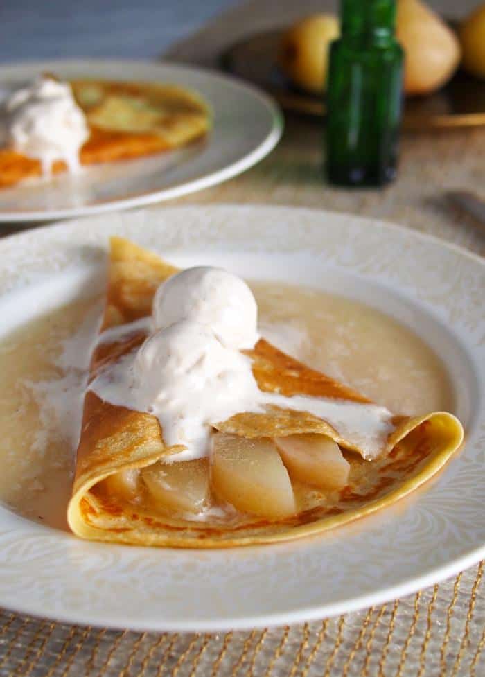 champagne pear crepes on white plate