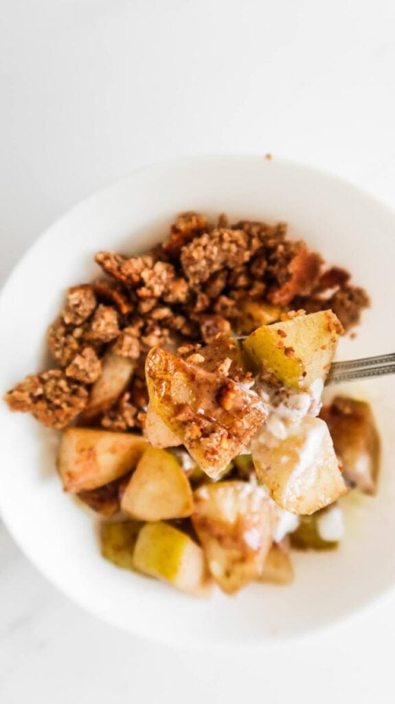 healthy pear crumble in white bowl