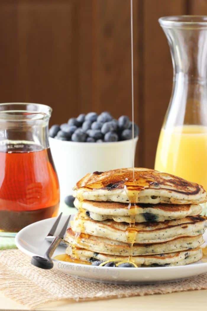 lemon poppyseed pancakes with a drizzle of syrup